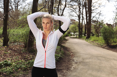 Focused female runner in forest