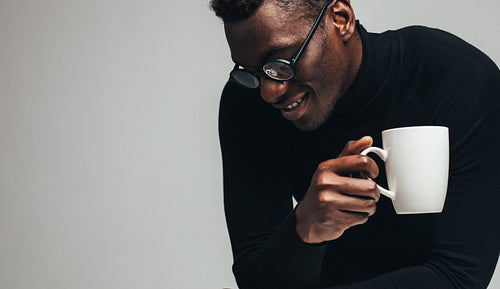 Man relaxing with a coffee
