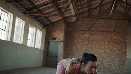 Fitness woman working out with kettle bell