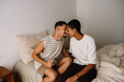 Loving couple sharing tender moment in bedroom