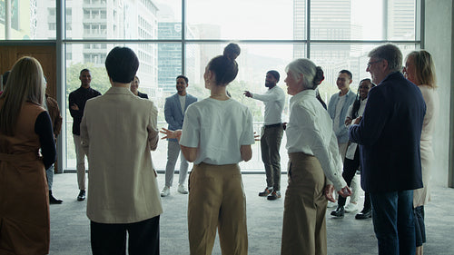 Business professionals networking in a room