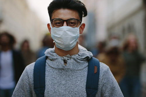 Man with a mask participating in a protest