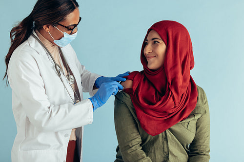 Muslim woman getting vaccine