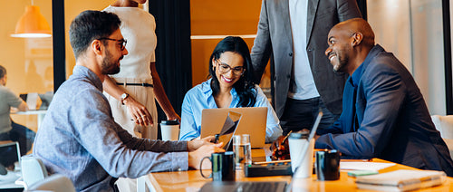 Group of professionals discussing ideas during a business meeting at the office