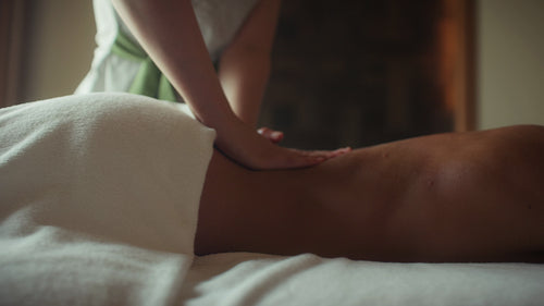 Relaxing back massage for a serene woman in a luxurious and tranquil spa setting
