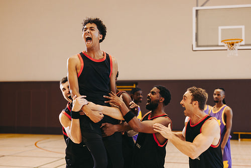 Final buzzer joy: Men's basketball team celebrates hard-earned win