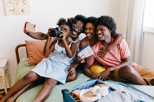 Family vacation: Parents and children capture travel memories with a selfie