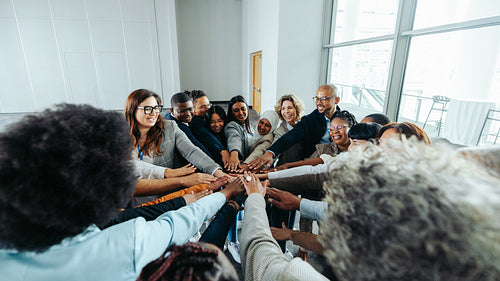 Diverse team of professionals collaborating together and solving problems in modern office