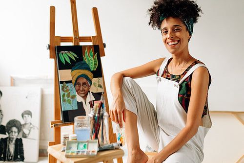 Female painter smiling in her studio