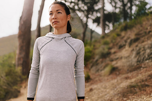 Fit woman runner outdoors on country road