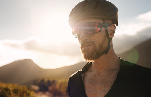 Athlete in cycling helmet and sunglasses