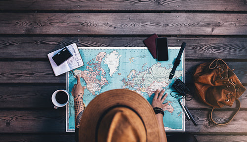 Tourist exploring the world map.