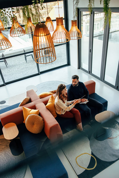 Overhead view of two business colleagues working in a lobby