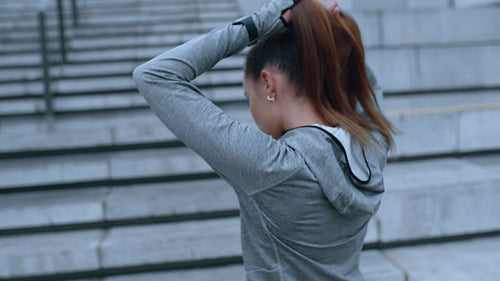 Woman getting ready for exercise in the city