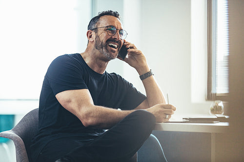 Businessman having a casual conversation on phone