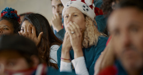 Worried American soccer fans at stadium