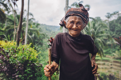 Old woman with beautiful smile in countryside