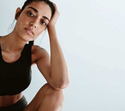 Tired woman relaxing after workout