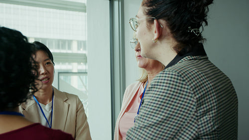 Professional women engaged in conference discussion