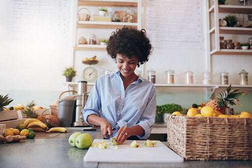 Young woman making fresh juice
