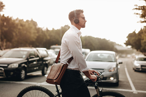 Side view of a businessman crossing the road