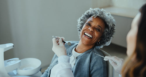 Senior woman patient meets the dentist for treatment and a dental exam in the clinic