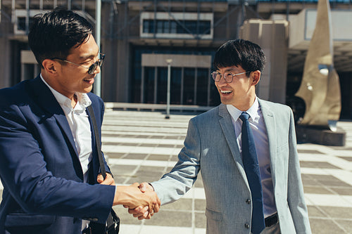 Two successful business men shaking hands