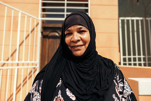 Cheerful Muslim woman looking at the camera with a smile