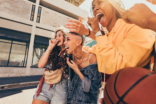 Friends laughing together outdoors