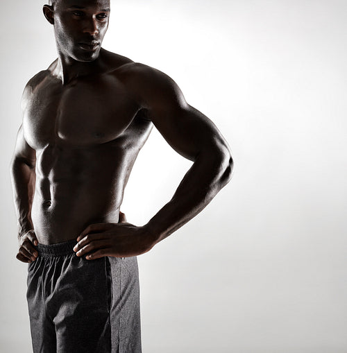 Strong young man posing confidently