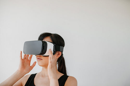 Young woman in VR headset looking away