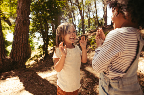 Cheerful girls playing clapping games