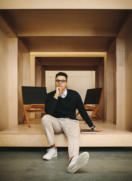 Businessman sitting in office inside an enclosure