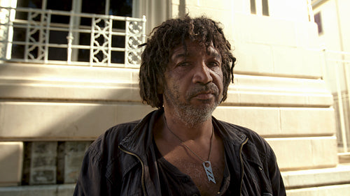 Person with not home standing outside