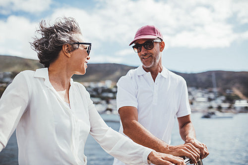 Happy mature couple on a boat enjoying their vacation