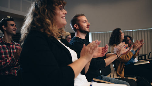 Business people applauding in a summit