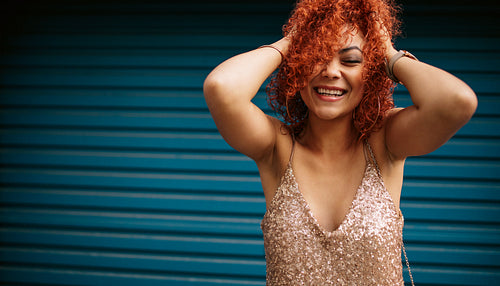 Young woman in glamorous dress.