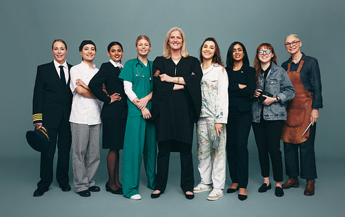 Cheerful female professionals smiling happily in a studio