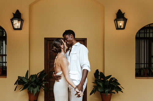 Happy couple sharing a romantic moment at their holiday home