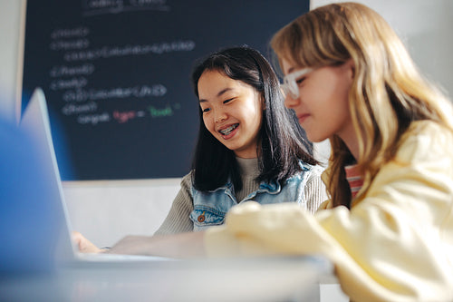 Digital literacy for the girl child: Kids engaging with each other in a primary school coding class
