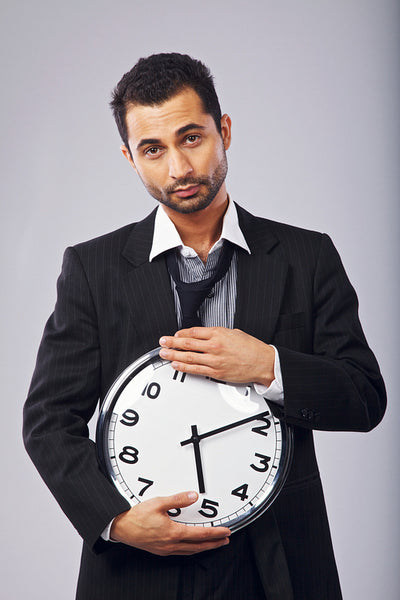 Male Office Worker with a Wall Clock