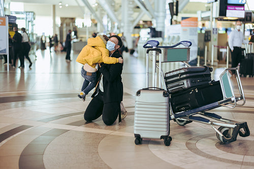 Mother arriving at airport meeting son