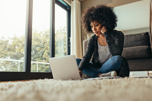 Female working on laptop at home