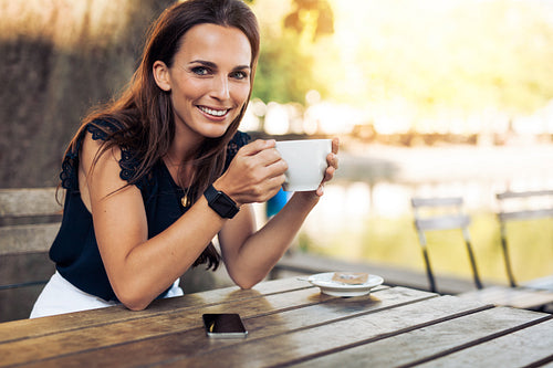 Beautiful young woman with a cup of coffee 