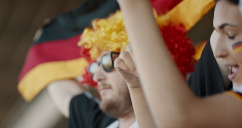 German soccer fan having fun during a game