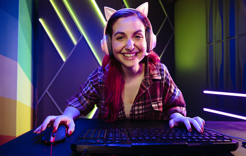 POV: Female gamer playing an exciting video game on her computer