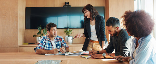 Creative team of professionals meeting in conference room