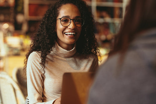 Woman at cafe with a friend