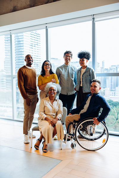 Workplace camaraderie: A business group shares a light moment