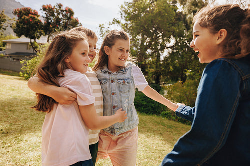 Happy children enjoying outdoor time together in a sunny park setting